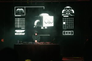Eptic with his signature robot mascot behind him on screen