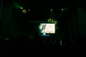 lyny with his glowing screen behind him as he djs in cleveland, ohio